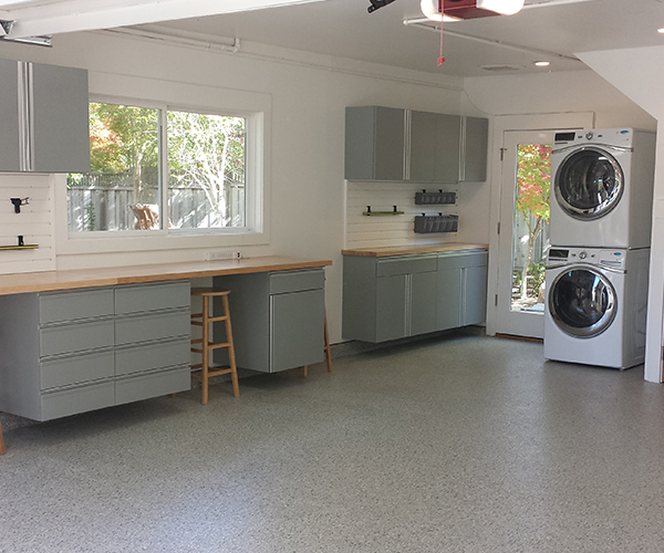 Image of a garage with custom cabinets.
